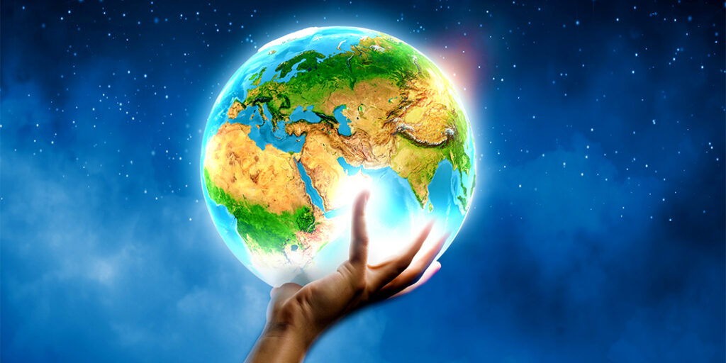 A hand holds the world demonstrating what is a biblical worldview