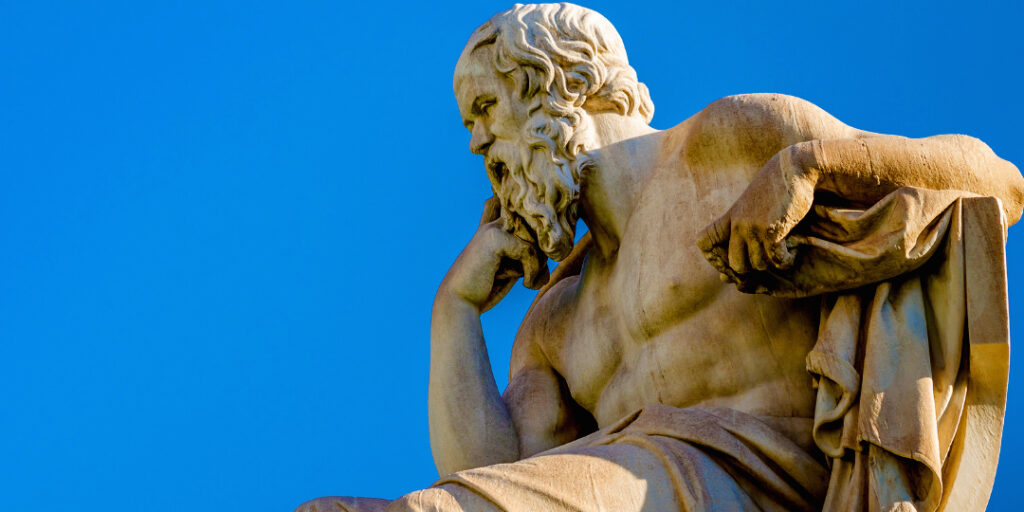 statue of ancient philosopher thinking about philosophical questions